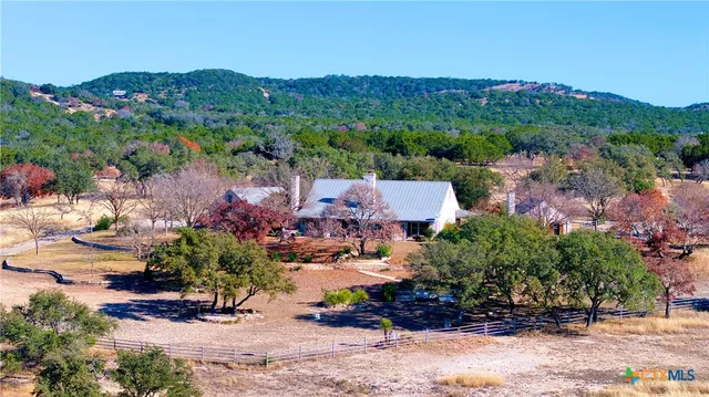 an aerial view of a house with a garden