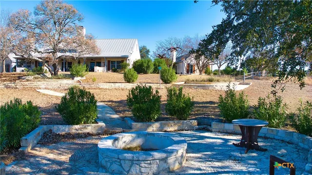 a view of a room with furniture and a window