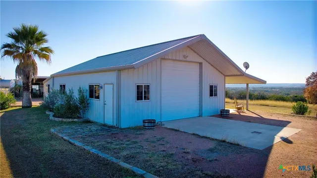 a view of a patio with couches and pool