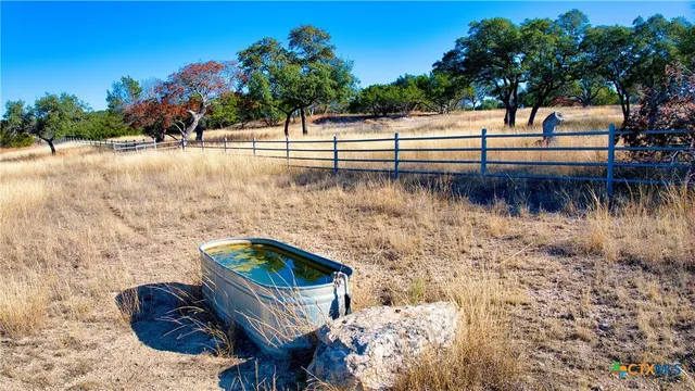 a view of a yard and an ocean