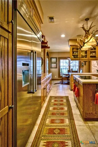 a kitchen that has a lot of cabinets in it