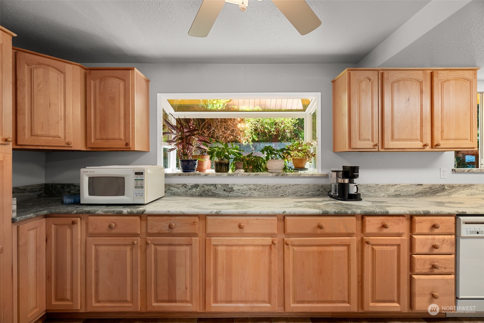 107 Peterson Road Chehalis, WA 98532 - Photo 18 of 35 a kitchen with granite countertop cabinets and window
