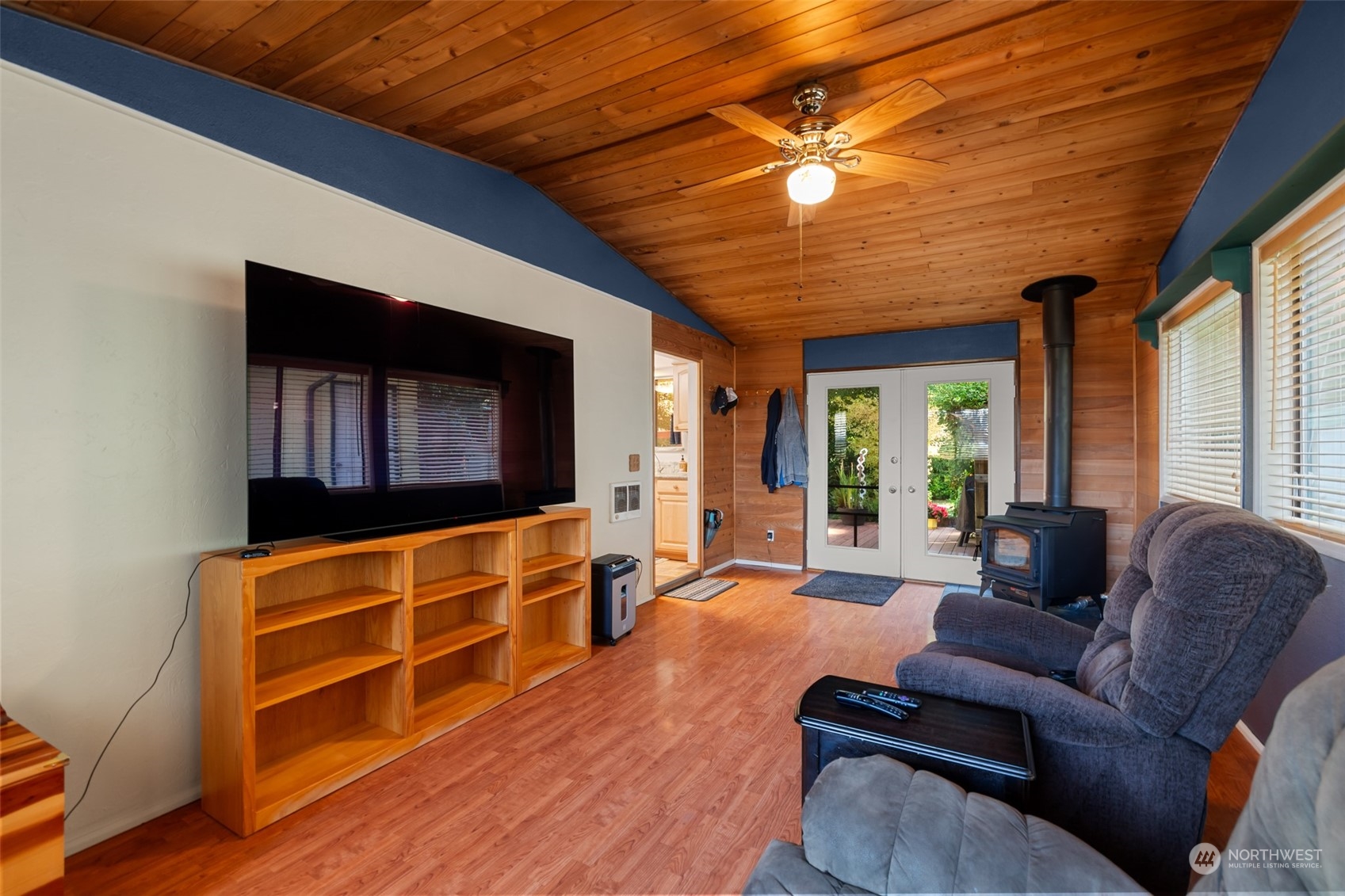 107 Peterson Road Chehalis, WA 98532 - Photo 23 of 35 a living room with furniture a flat screen tv and wooden floor