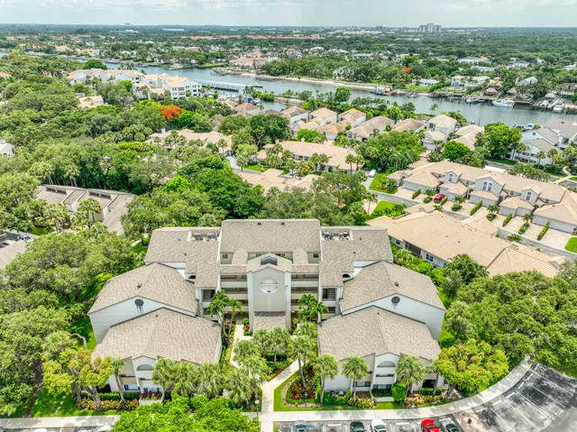 an aerial view of a house with a lake view