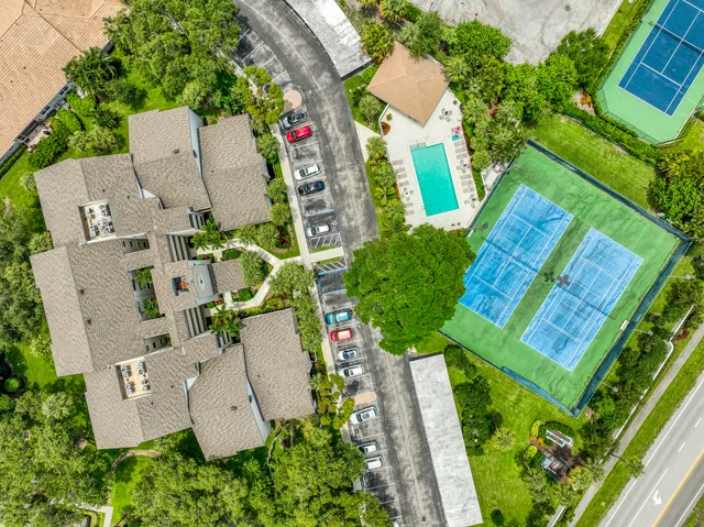 an aerial view of house with yard