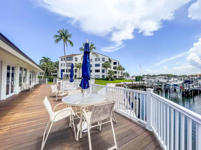a view of a chair and tables in the balcony