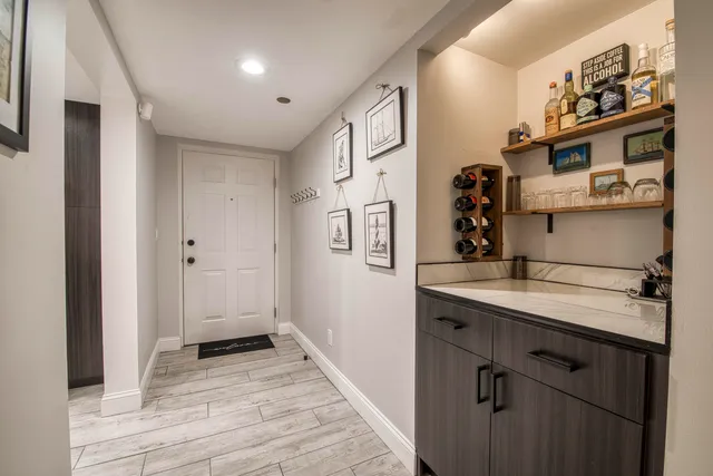 a kitchen with stainless steel appliances granite countertop a sink and cabinets