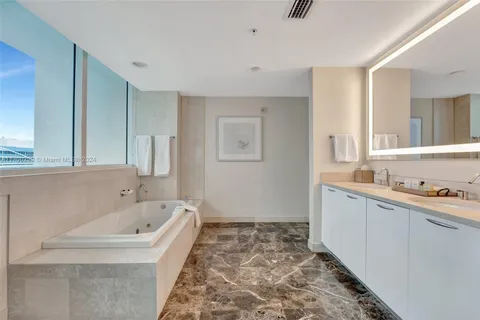 a bathroom with a bathtub and a sink