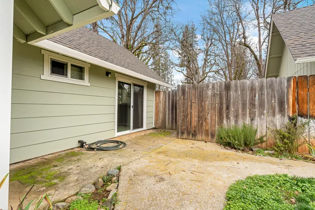 a kitchen with granite countertop sink cabinets and window