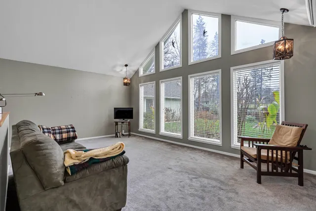 a bathroom with a sink mirror and toilet