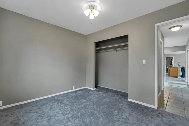 a view of backyard with swimming pool and table