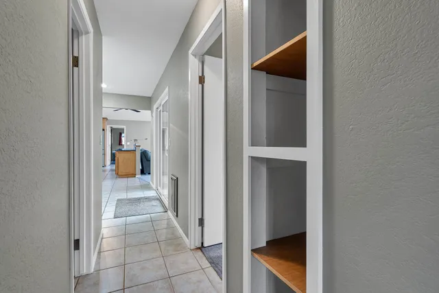 a green field with lots of trees