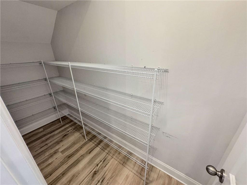 677 Stickley Oak Way Woodstock, GA 30189 - Photo 12 of 30 a view of closet with wooden floor