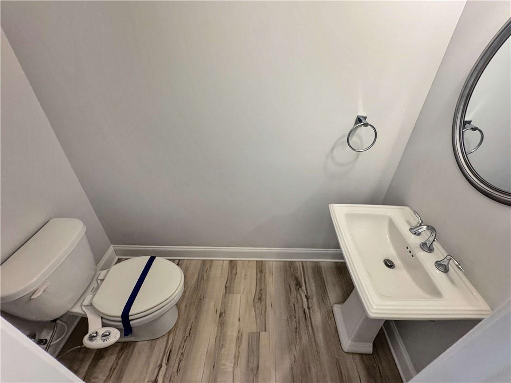 677 Stickley Oak Way Woodstock, GA 30189 - Photo 13 of 30 a view of a room with rack and white walls