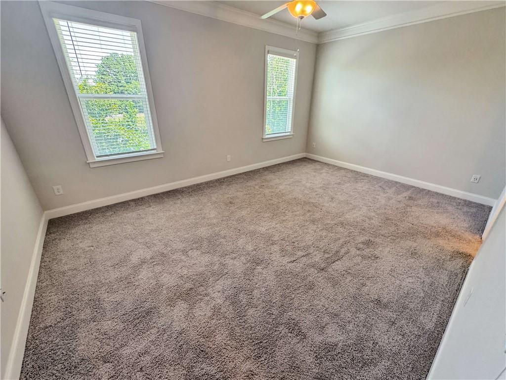 677 Stickley Oak Way Woodstock, GA 30189 - Photo 16 of 30 an empty room with windows