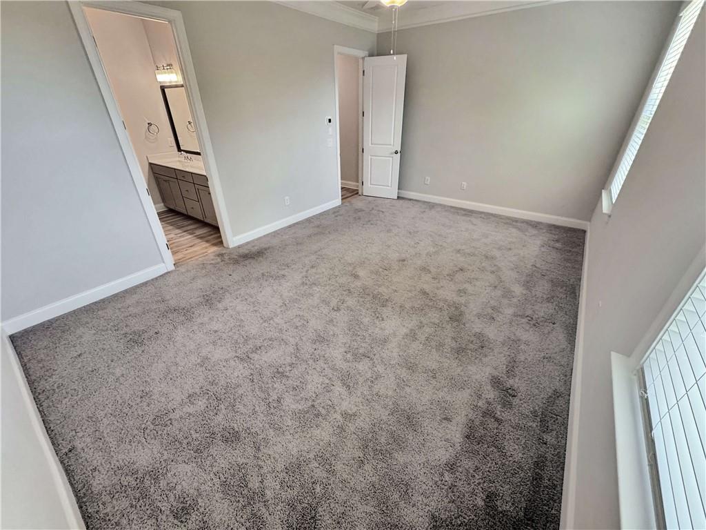 677 Stickley Oak Way Woodstock, GA 30189 - Photo 17 of 30 an empty room with a hallway