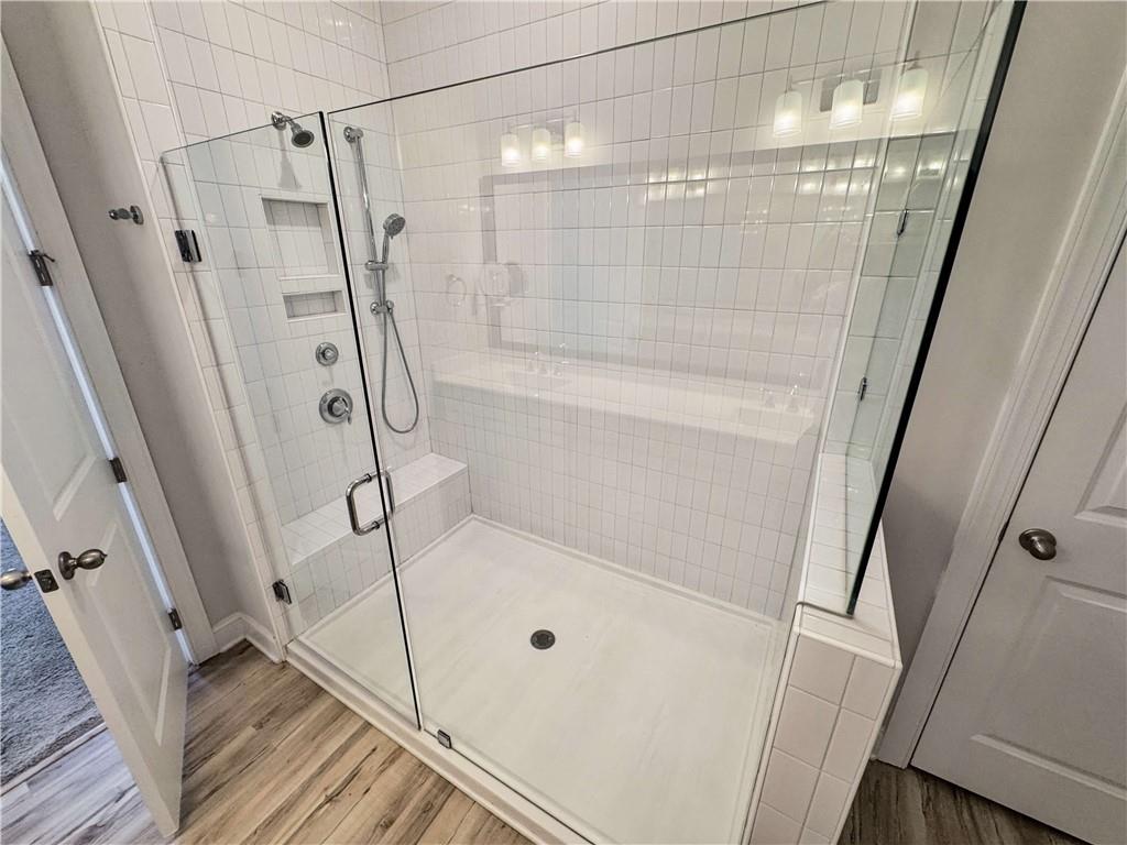 677 Stickley Oak Way Woodstock, GA 30189 - Photo 19 of 30 a bathroom with a shower