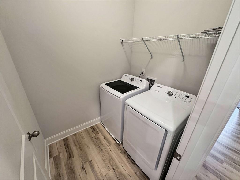 677 Stickley Oak Way Woodstock, GA 30189 - Photo 22 of 30 a utility room with dryer and washer