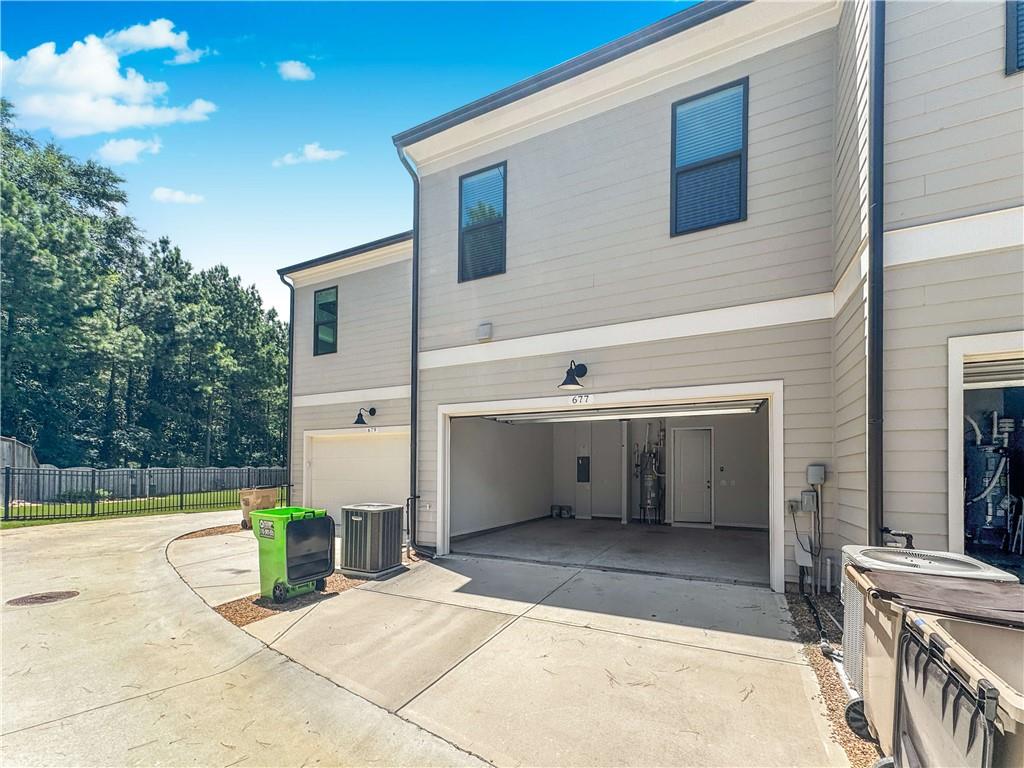 677 Stickley Oak Way Woodstock, GA 30189 - Photo 30 of 30 a view of a house with backyard