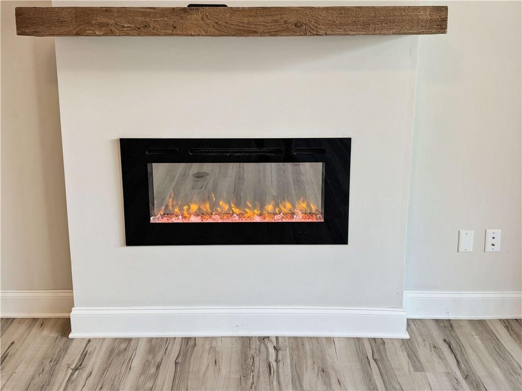 677 Stickley Oak Way Woodstock, GA 30189 - Photo 5 of 30 a view of a living room with a wooden floor