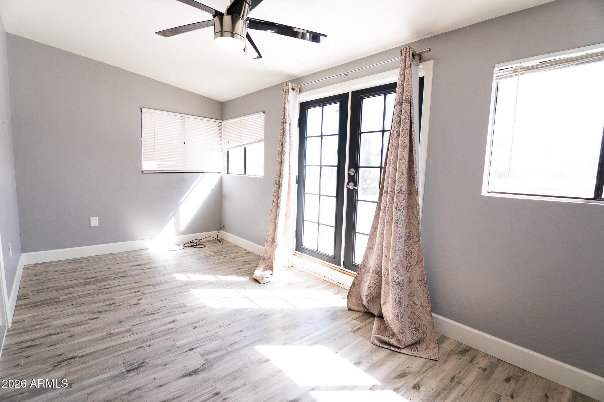 5100 North Miller Road, Unit 3 Scottsdale, AZ 85250 - Photo 14 of 31 a view of entryway and kitchen with wooden floor