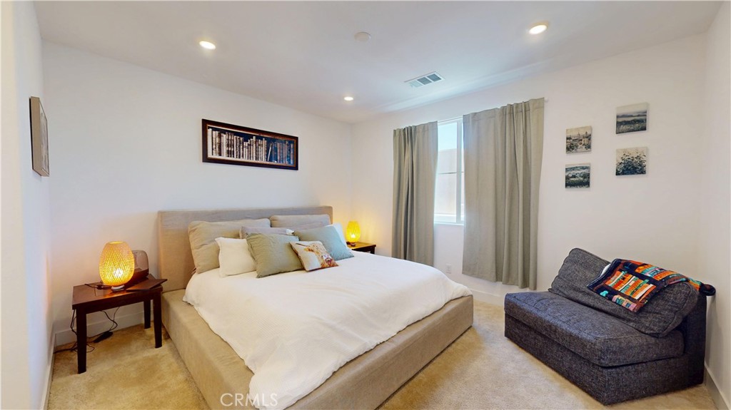 2221 Bluegrass Way Rancho Mission Viejo, CA 92694 - Photo 13 of 35 a bedroom with a bed and a couch
