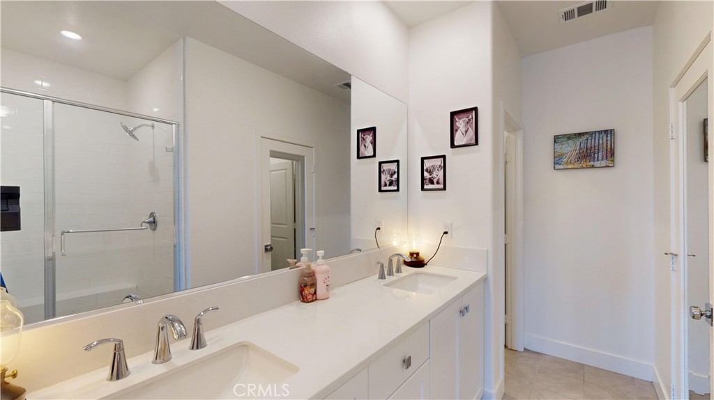 2221 Bluegrass Way Rancho Mission Viejo, CA 92694 - Photo 15 of 35 a bathroom with a sink and a mirror