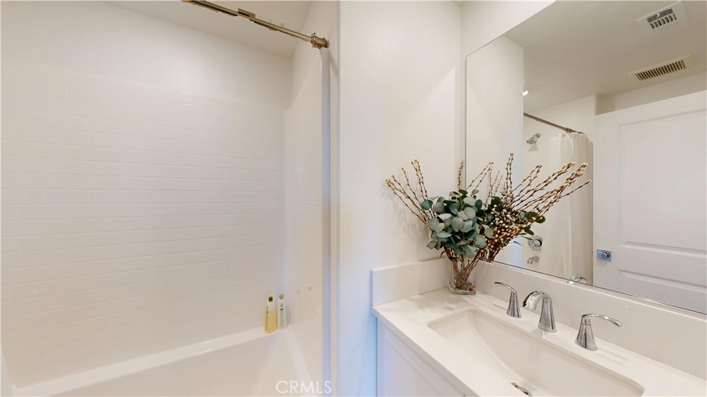 2221 Bluegrass Way Rancho Mission Viejo, CA 92694 - Photo 20 of 35 a bathroom with a sink and a mirror