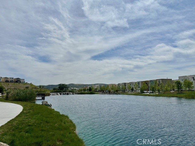 2221 Bluegrass Way Rancho Mission Viejo, CA 92694 - Photo 29 of 35 a view of a lake with houses in the back
