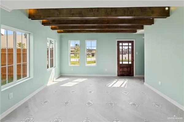 a view of a kitchen center island and stainless steel appliances