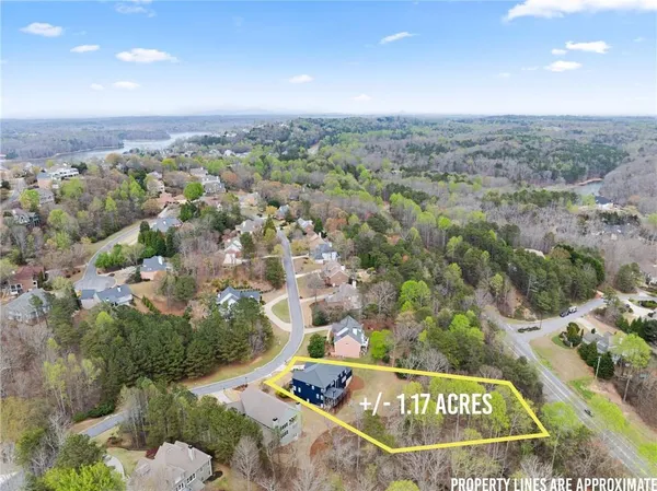an aerial view of a house with a lake view