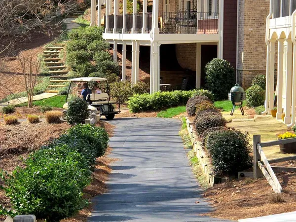 an aerial view of a house with a yard and lake view