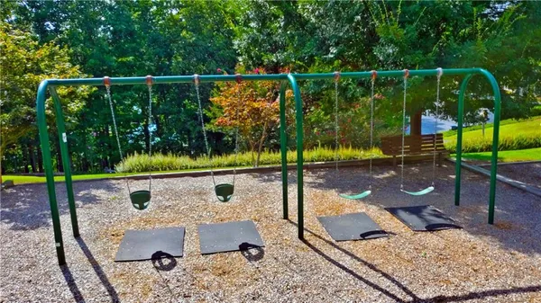 a bedroom with a large bed and a ceiling fan