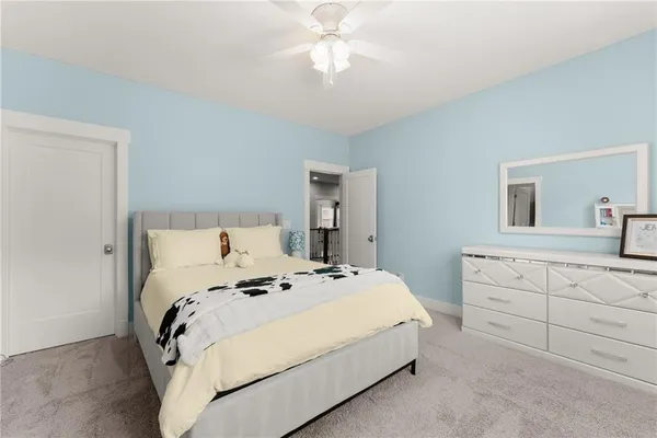 a spacious bathroom with a granite countertop sink mirror and a