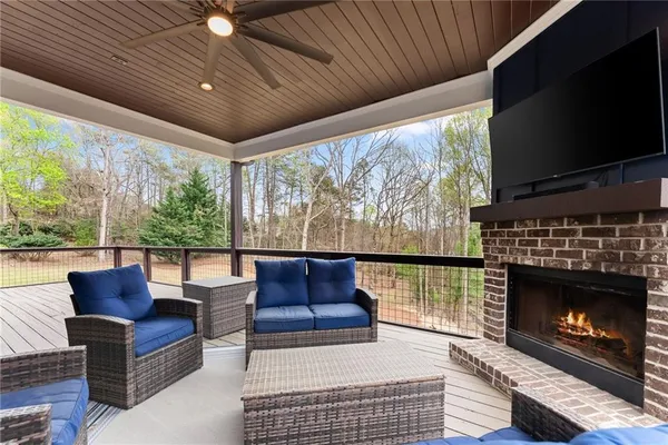 a living room with fireplace furniture and a flat screen tv