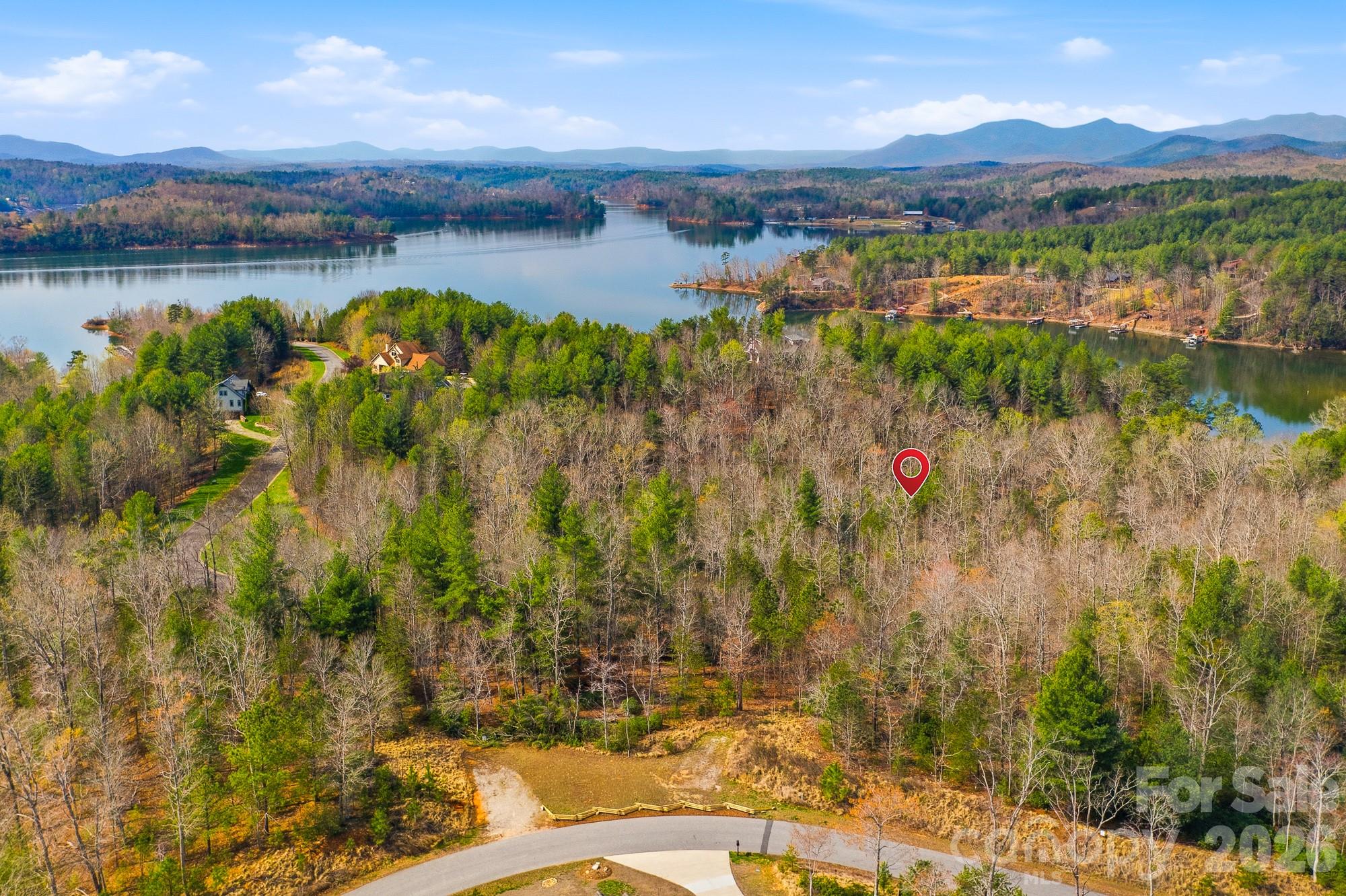 a view of a lake with houses in the back