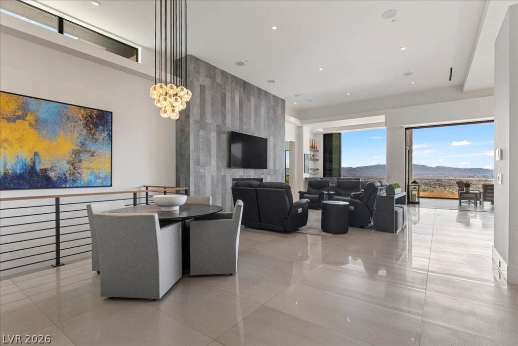 657 Ridgestone Rim Court Henderson, NV 89012 - Photo 14 of 97 High ceilings and polished tile floors frame a spacious interior with far-reaching mountain views.