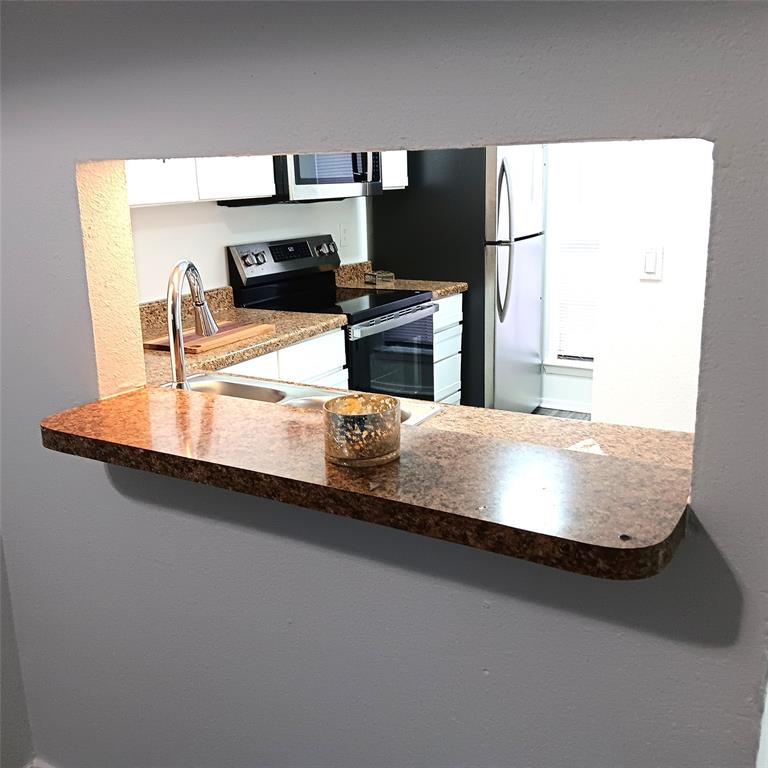 708 West Collins Street Denton, TX 76201 - Photo 12 of 40 Breakfast bar looking into the kitchen