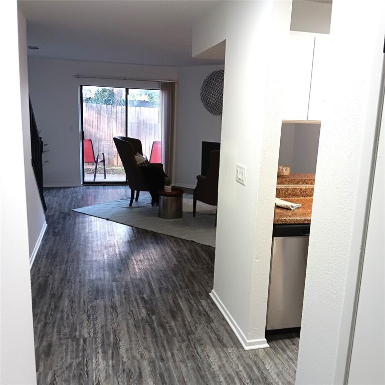 708 West Collins Street Denton, TX 76201 - Photo 3 of 40 Entryway with light gray wood-pattern vinyl plank flooring
