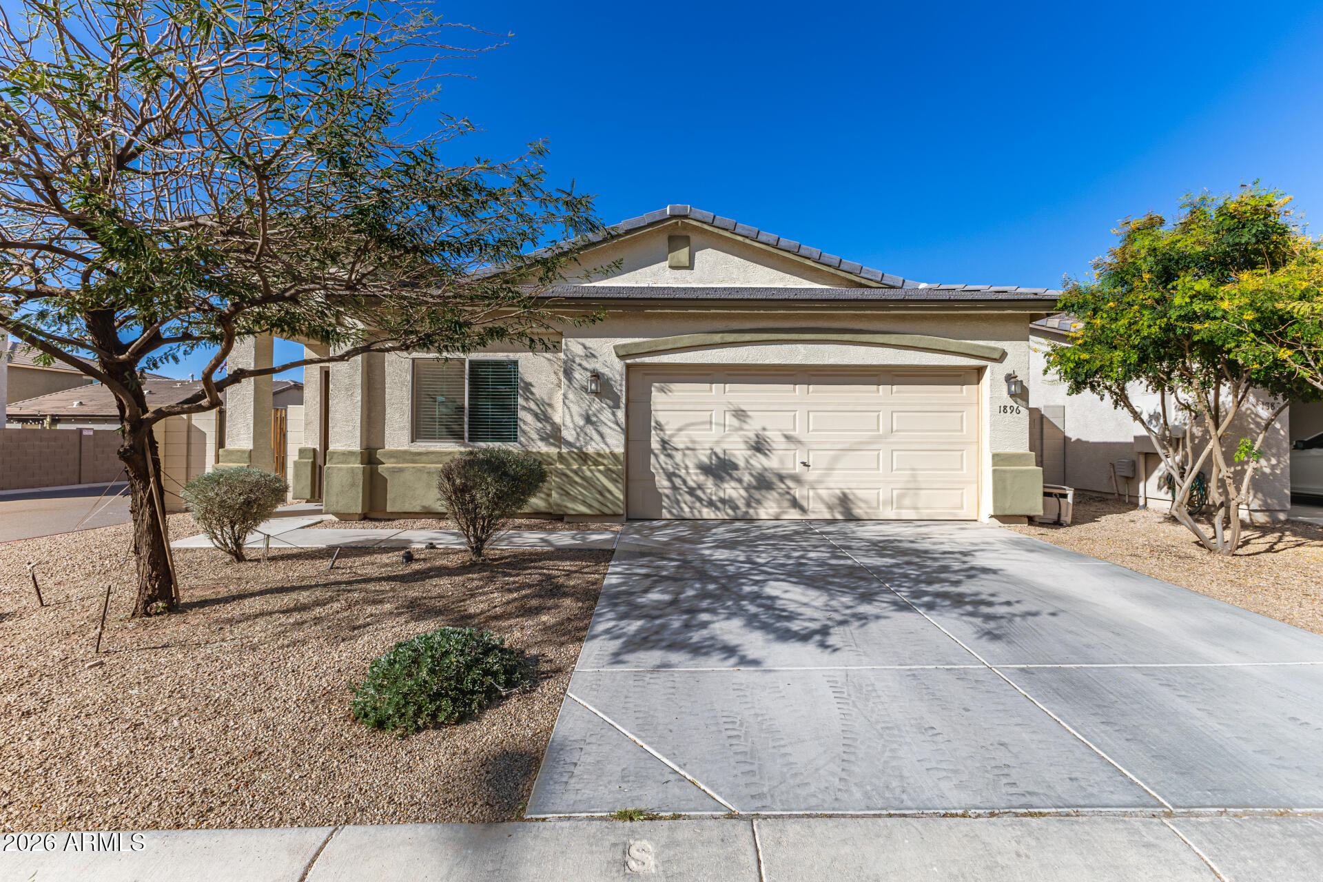 1896 West Rd Agent Street Apache Junction, AZ 85120 - Photo 1 of 21 a front view of a house with garden