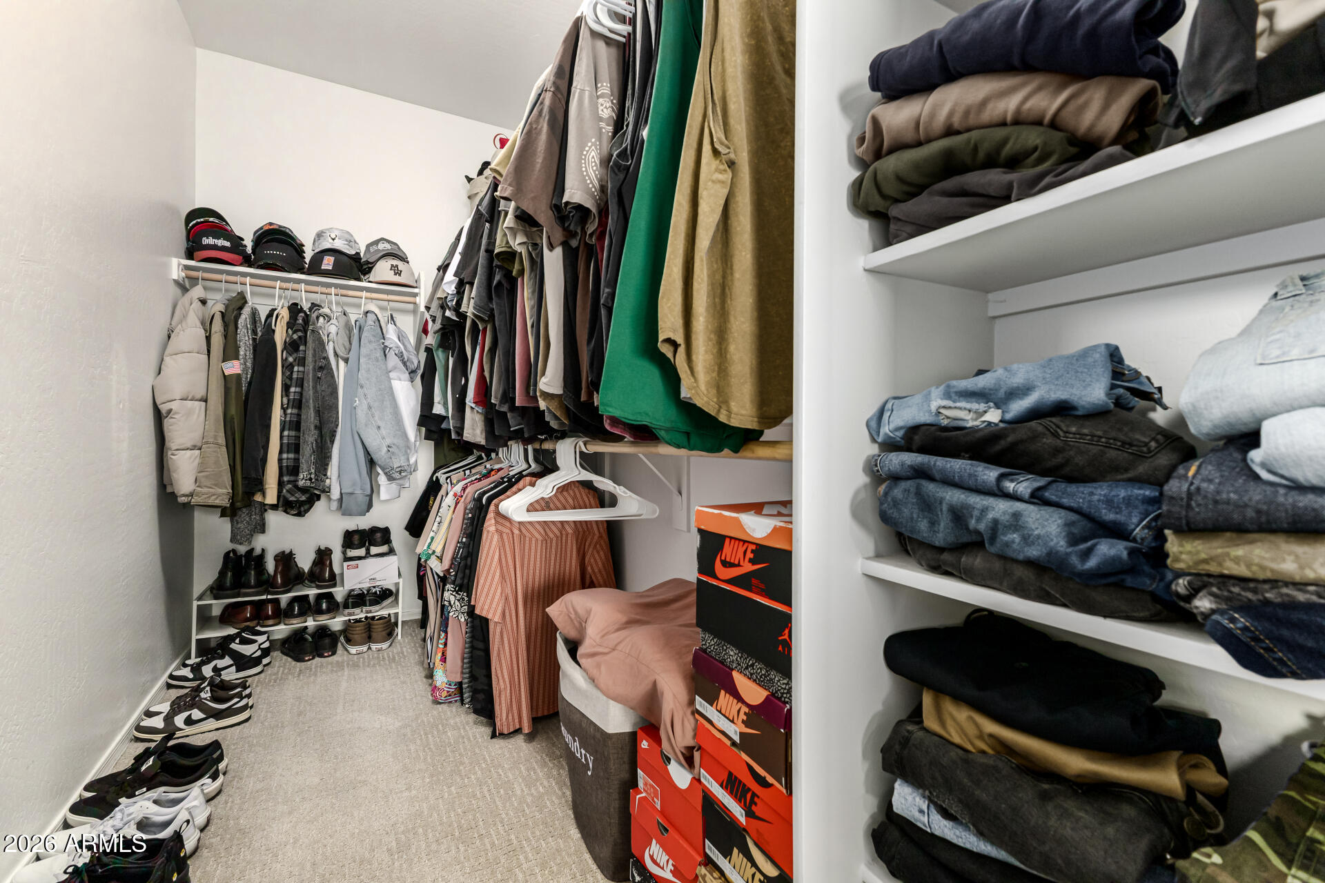 1896 West Rd Agent Street Apache Junction, AZ 85120 - Photo 15 of 21 a view of walk in closet with clothes and shoes