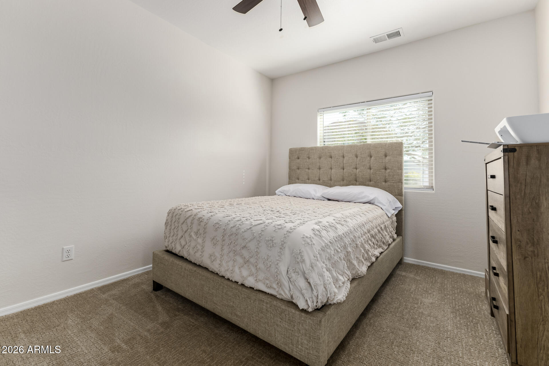 1896 West Rd Agent Street Apache Junction, AZ 85120 - Photo 17 of 21 a bed sitting in a bedroom next to a window