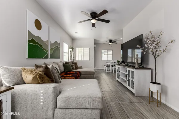 a living room with furniture fireplace and flat screen tv