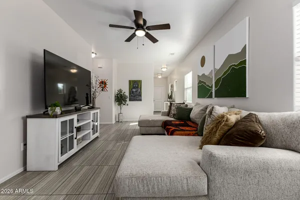 a living room with furniture and a flat screen tv