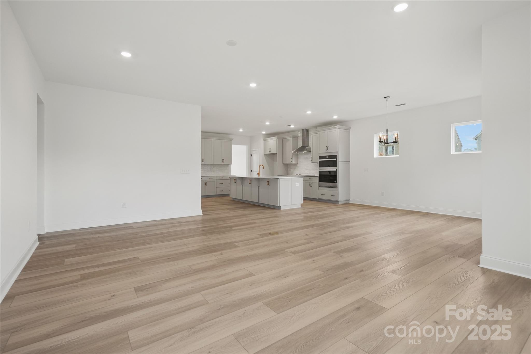 9373 Moss Plantation Avenue Northwest Concord, NC 28027 - Photo 14 of 27 a view of kitchen and refrigerator