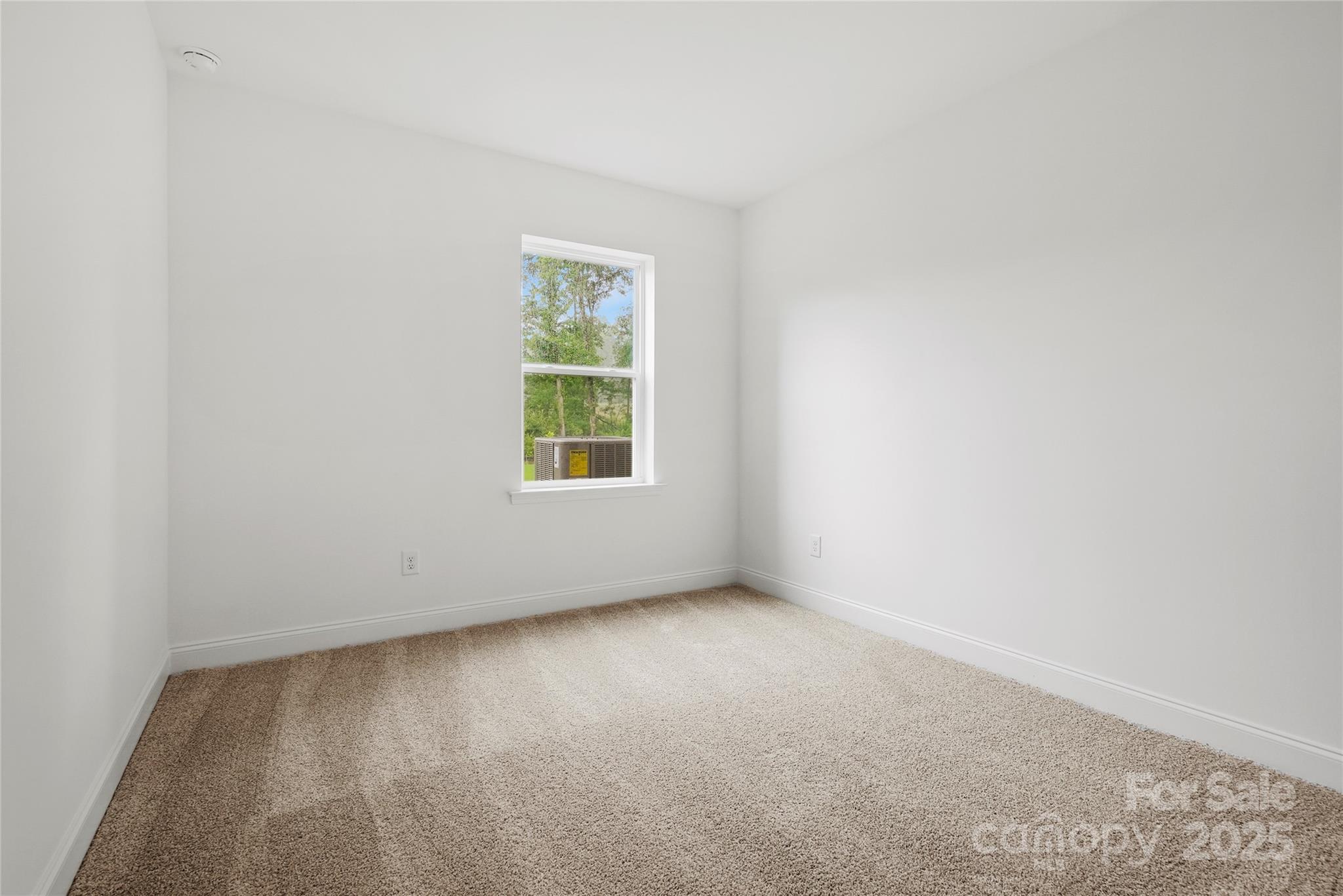 9373 Moss Plantation Avenue Northwest Concord, NC 28027 - Photo 27 of 27 an empty room with a window