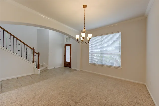 a view of a chandelier and a chandelier in a room