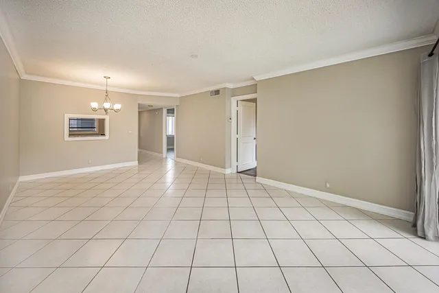 a view of an empty room and window