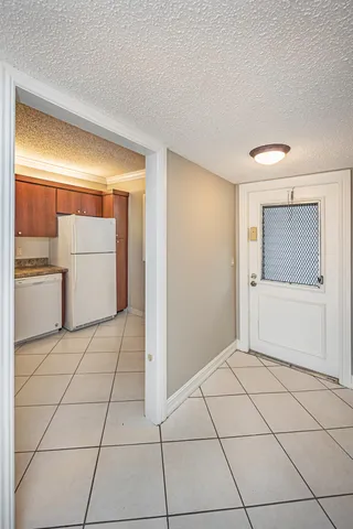 a view of a livingroom with an empty space and a sink