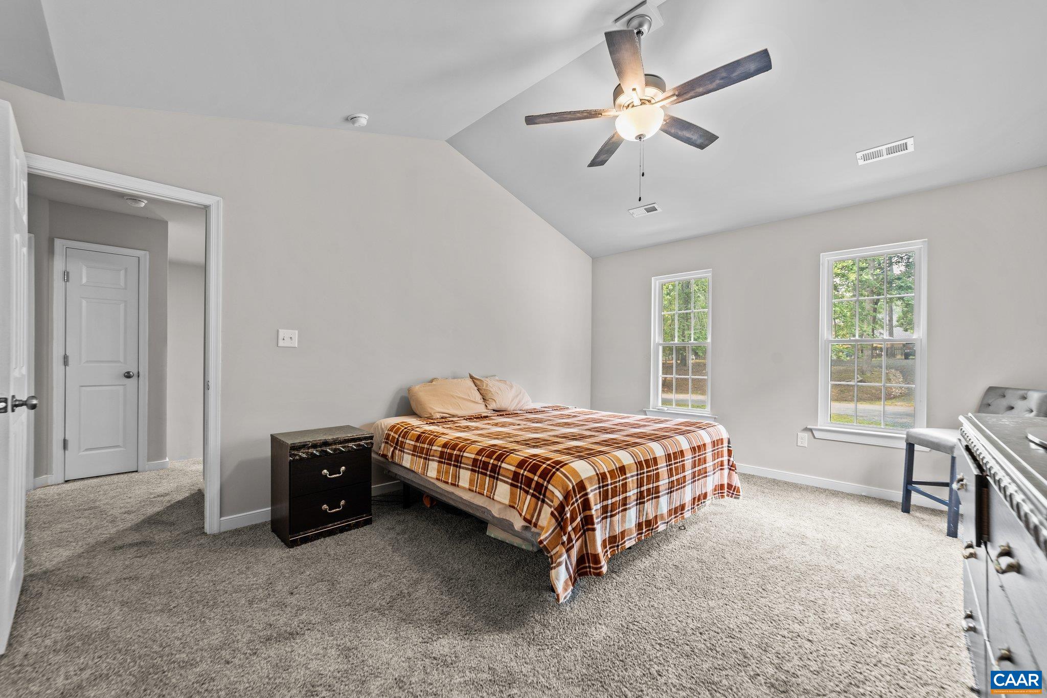39 Amethyst Road Palmyra, VA 22963 - Photo 21 of 42 a bedroom with a bed and a table in it